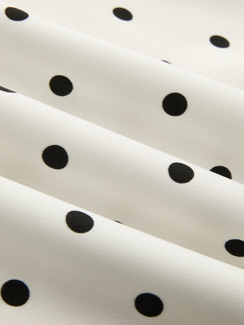 Anique | Satijnen midi rok met stippenprint en kanten details