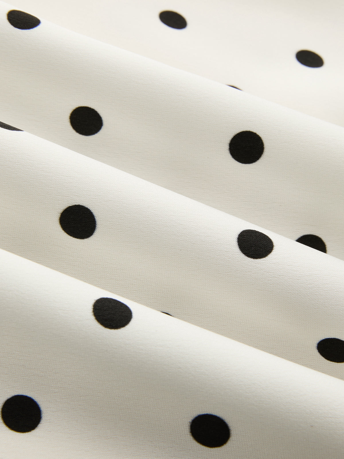 Anique | Satijnen midi rok met stippenprint en kanten details