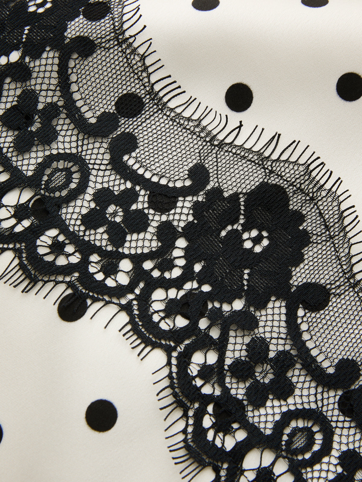 Anique | Satijnen midi rok met stippenprint en kanten details