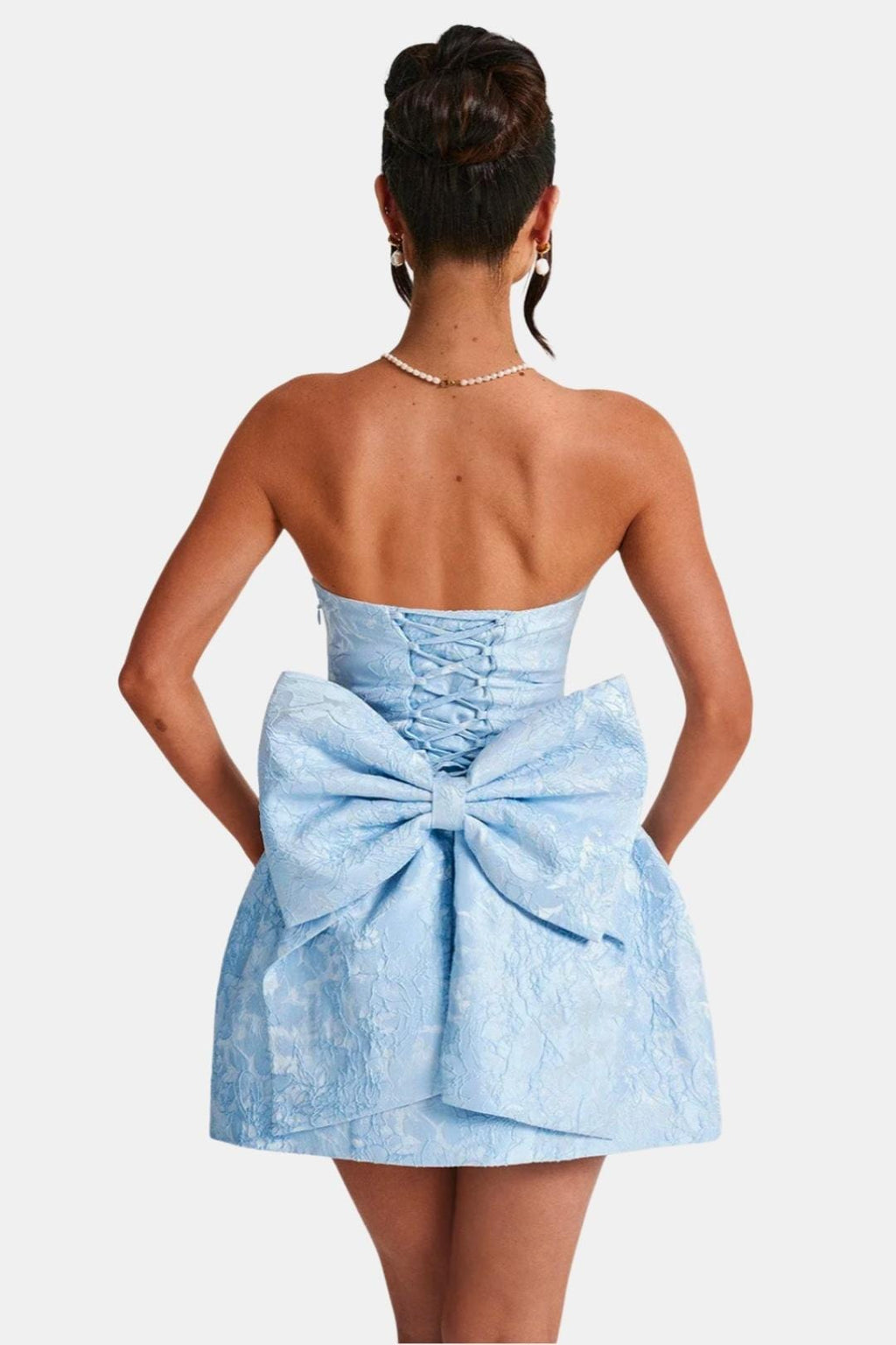 Sil | Strapless minijurk met strikband en bloemenprint