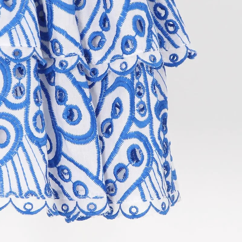 Stella | Strapless minijurk met broderie anglaise